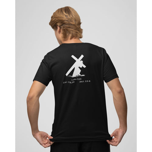 Person wearing a black t-shirt with a white graphic and text on the back, standing against a plain background.