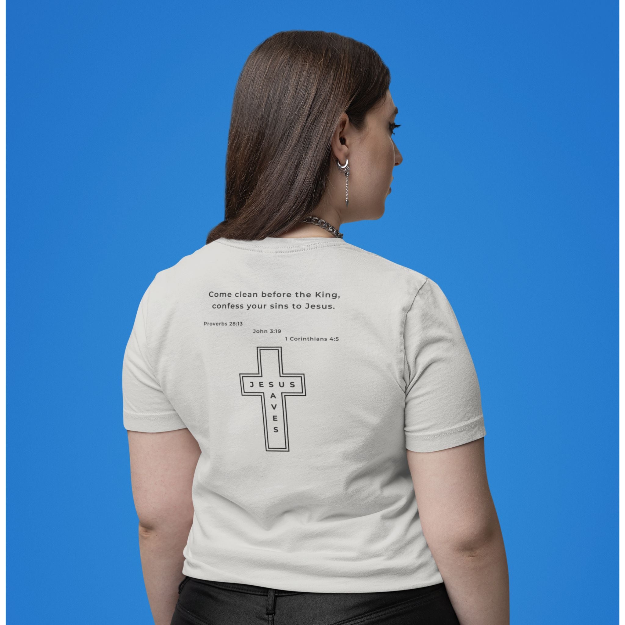Person wearing a white t-shirt with a cross design and text on the back against a blue background