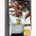 Christian t-shirt featuring a cross at sunset with a kneeling figure and the message "Now is the day of salvation" referencing 2 Corinthians 6:2 printed on the front.